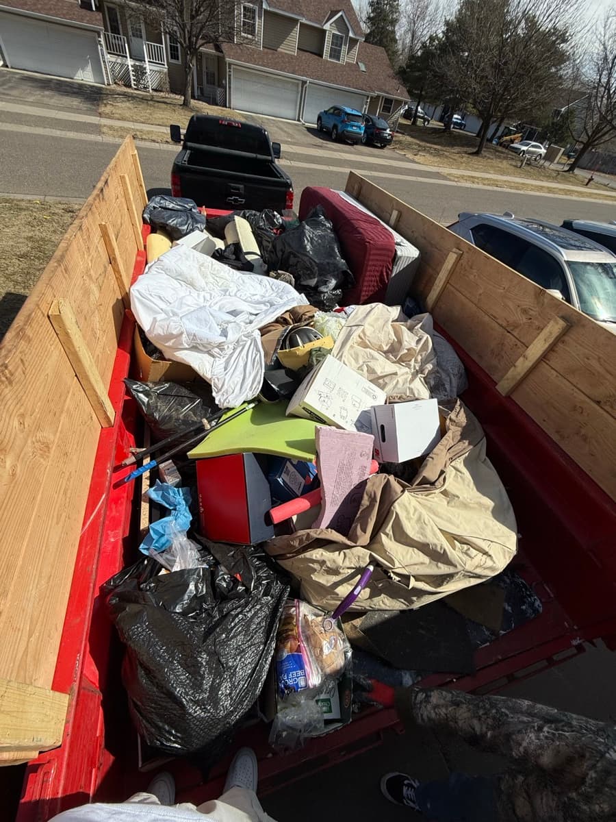 Trailer loaded with yard waste and outdoor debris