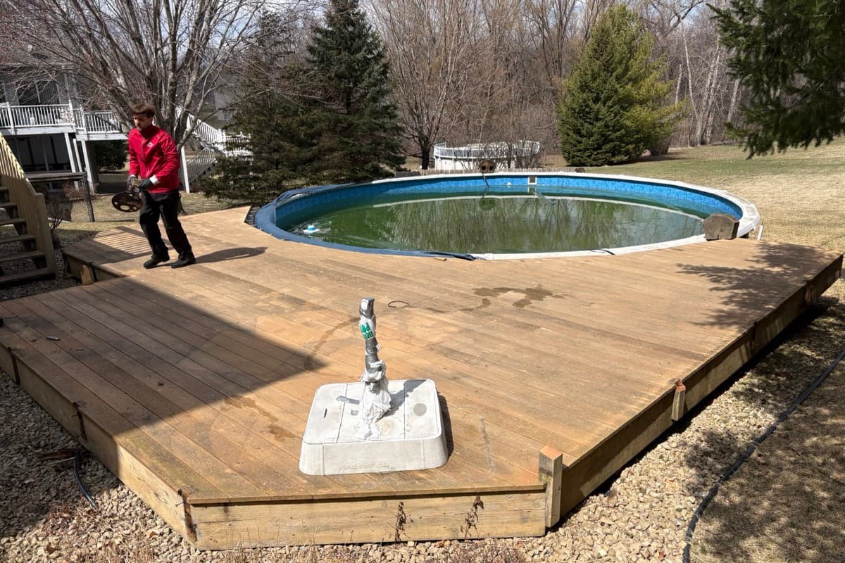 Above-ground pool and old deck before removal
